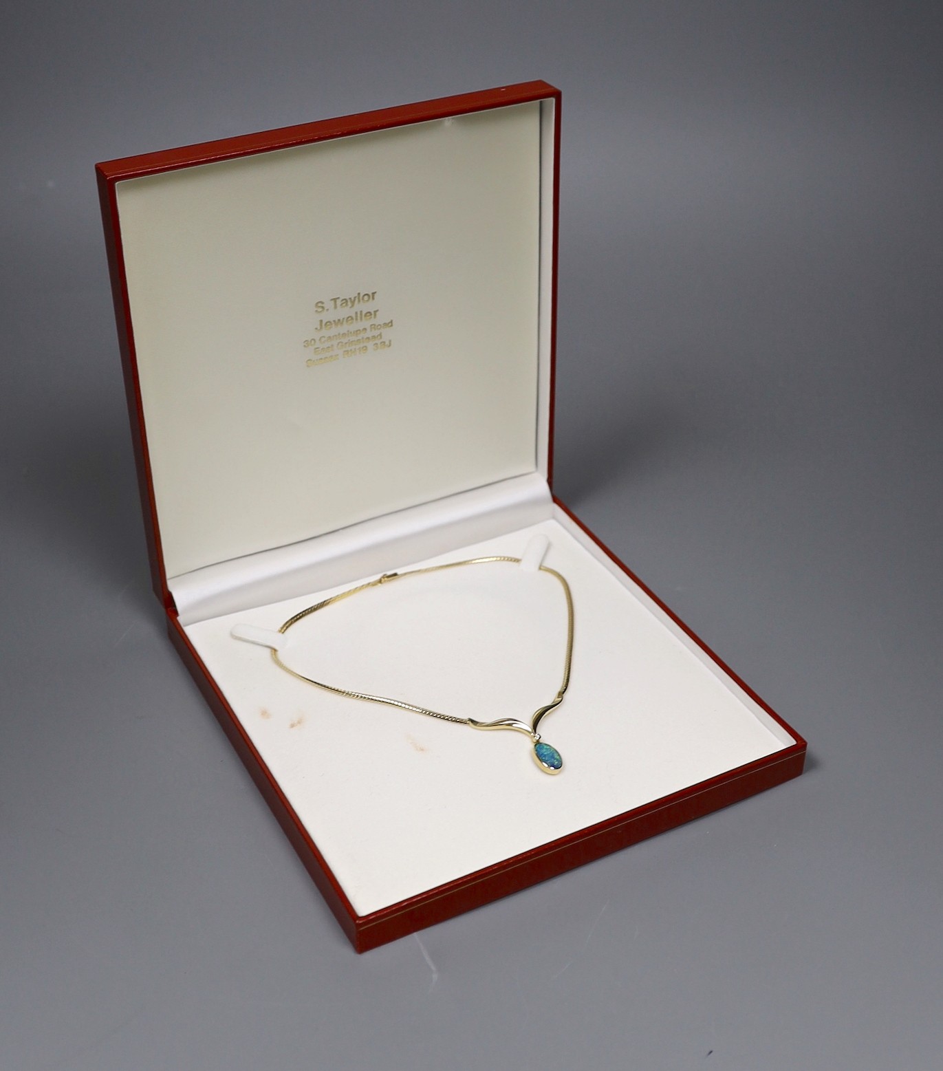 A modern 585 yellow metal and black opal doublet? and diamond set drop pendant necklace, overall 37cm, gross weight 12.5 grams.
